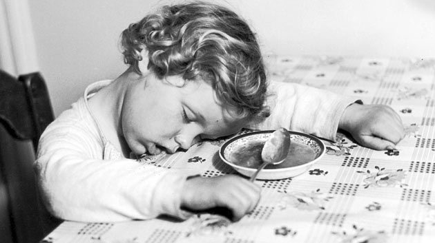 child_sleeping_at_table